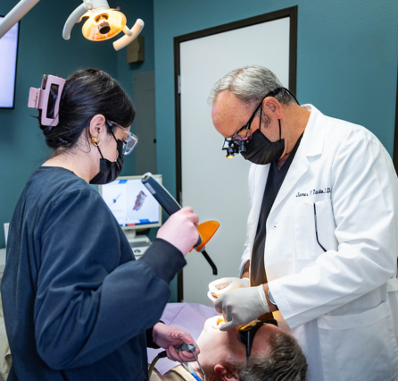 Dentist and Assistant Performing Cosmetic and Restorative Dental Treatment at Scripps West Dental in Mira Mesa