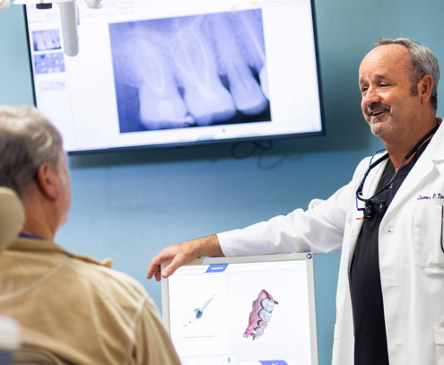 Digital dental X-rays being reviewed with a patient at Scripps West Dental in Mira Mesa
